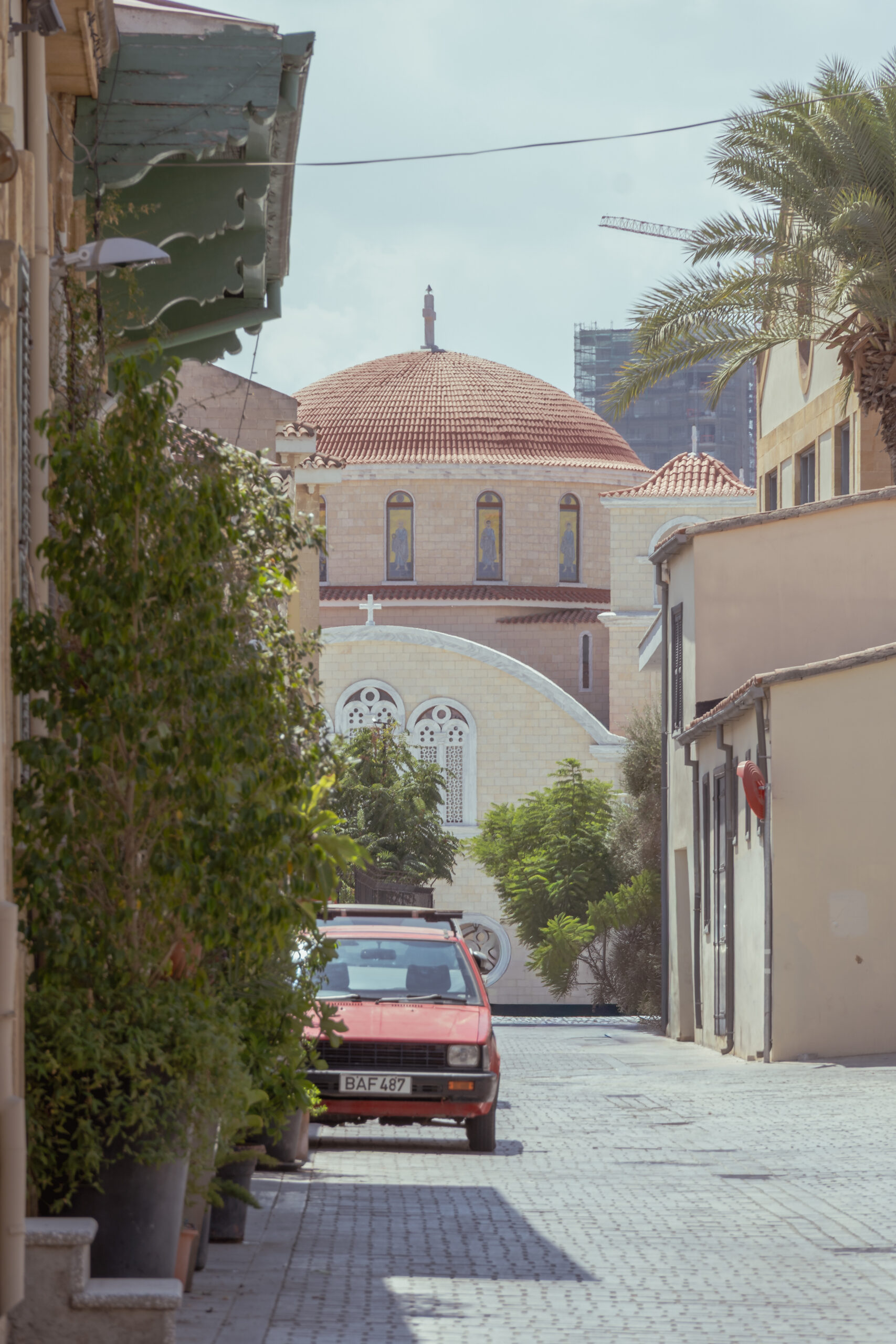 Traditional street in Nicosia with an Orthodox church dome in the background, Cyprus.