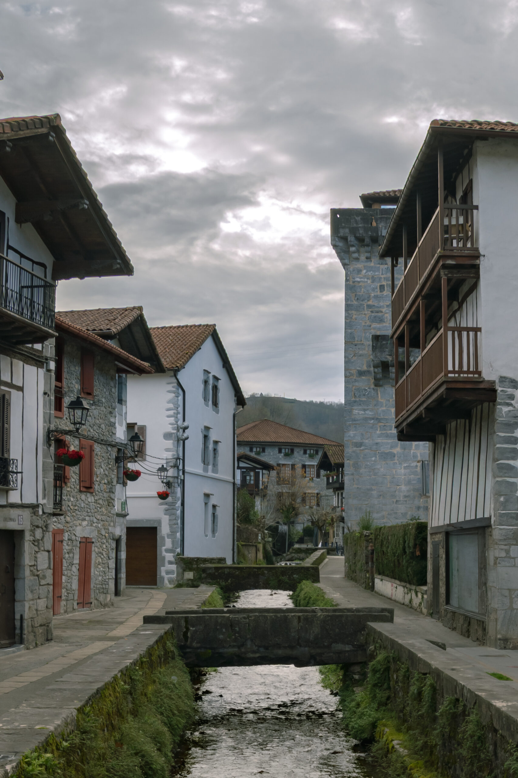 Traditional Basque houses lining the stream that flows through Lesaka, Navarre, Spain.