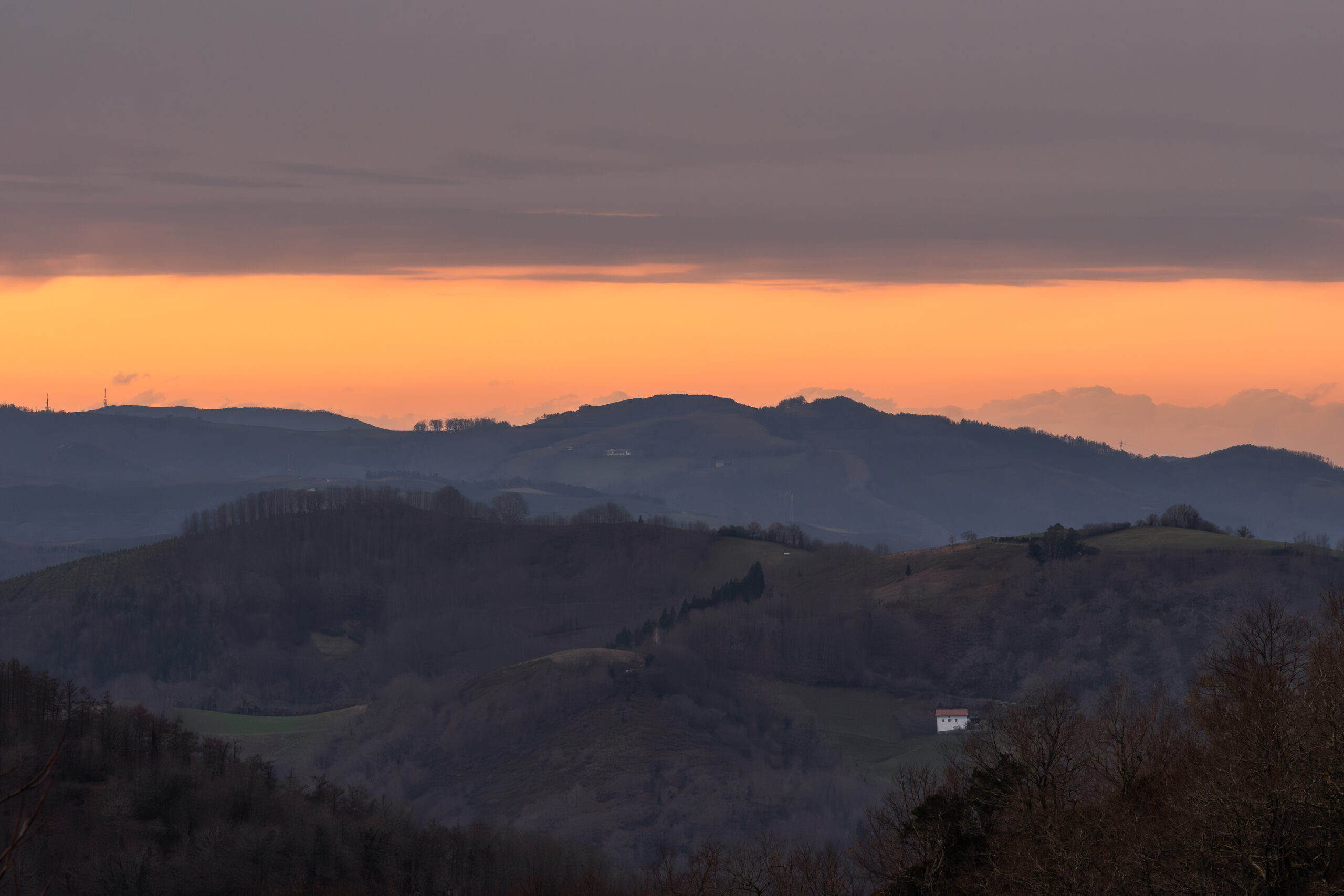 Low winter clouds over the hills surrounding Etxalar in the Basque Country, Spain.