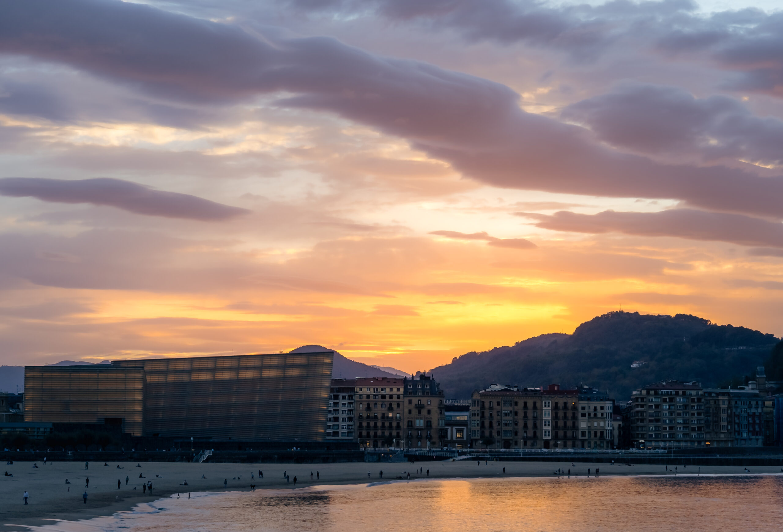 Evening light over Zurriola Beach with the Kursaal and Mount Ulia in San Sebastián, Spain.
