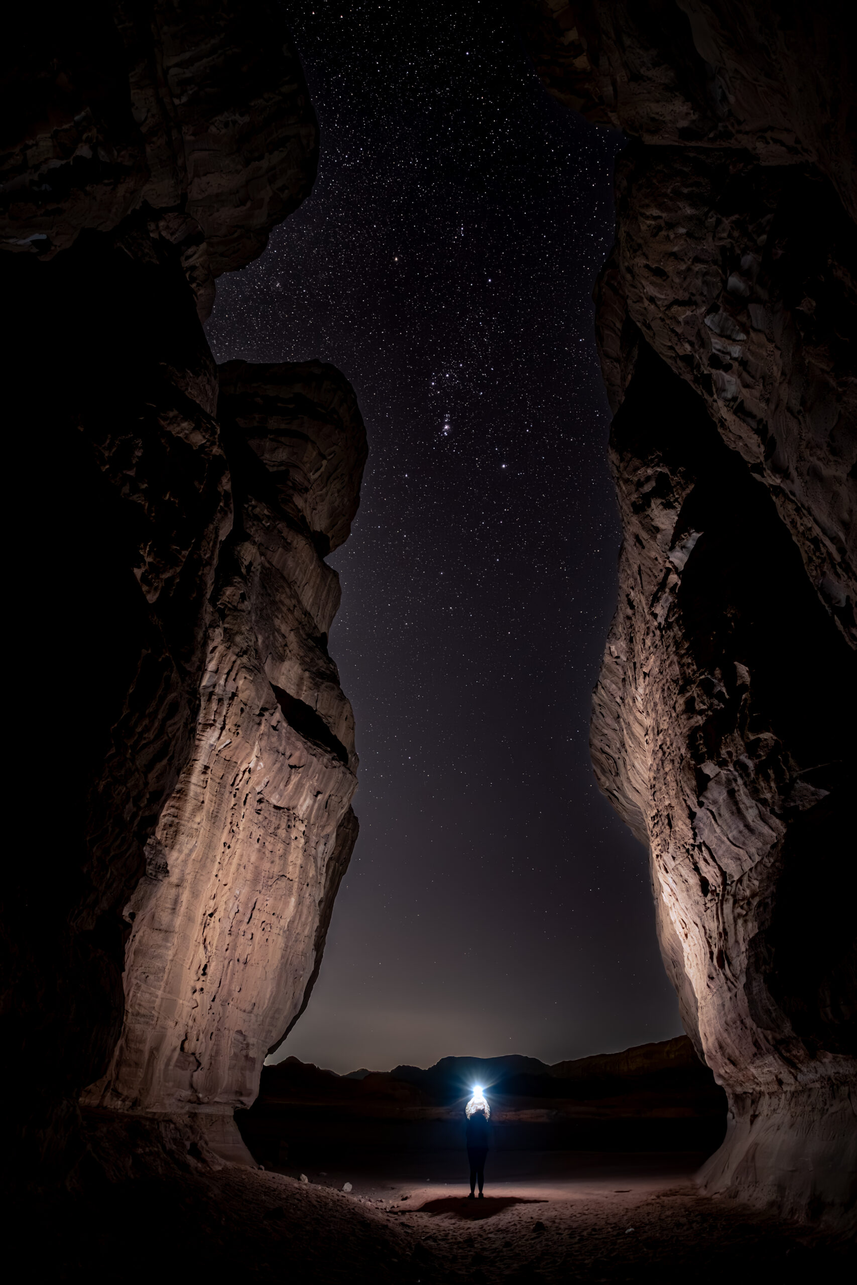 Sandstone pillars under the stars in Timna Park, Israel, with Orion rising above the Negev Desert.