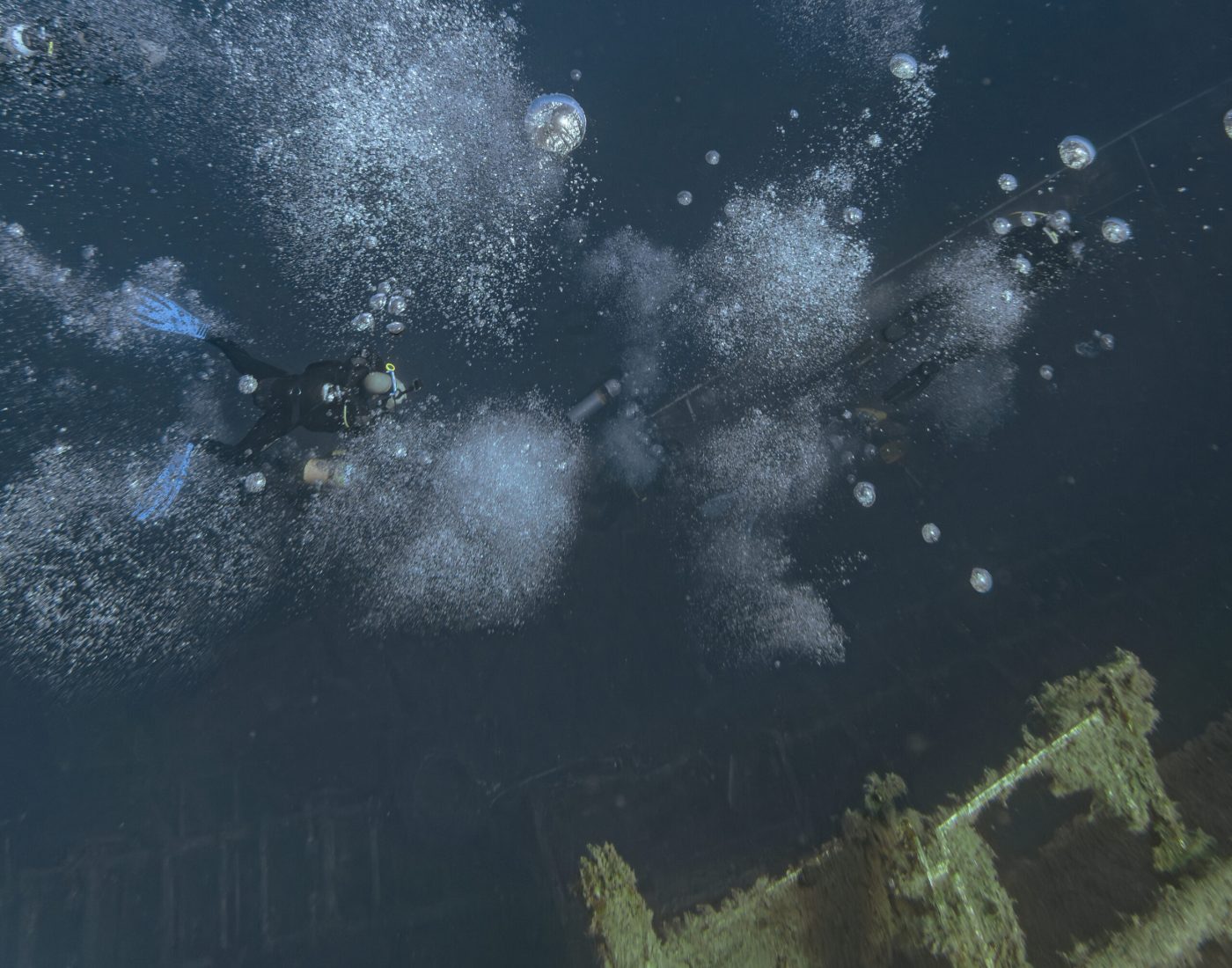 Divers descending toward the Zenobia Wreck in the Mediterranean Sea near Larnaca, Cyprus.