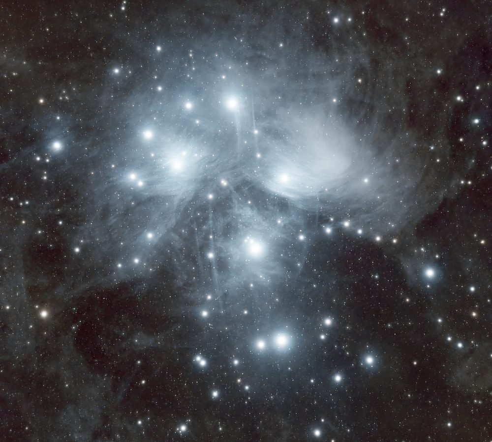 Pleiades (M45) captured under the dark skies of the Negev Desert, revealing the blue reflection nebulosity surrounding this famous open star cluster.